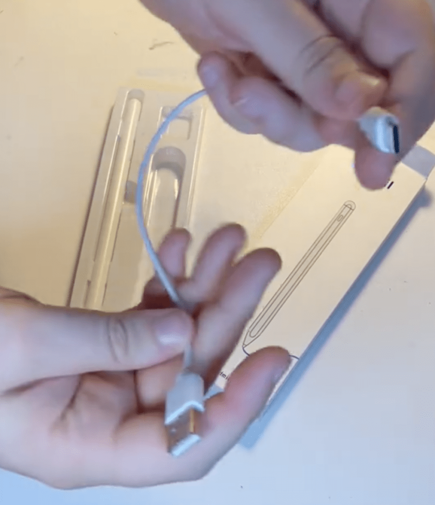 Here's the USB cable included with the device, along with the box it came in in the background, and the Pencil still in the inner packaging.